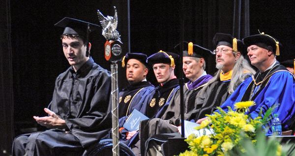 Stephen Zuravel, left, speaks during Commencement