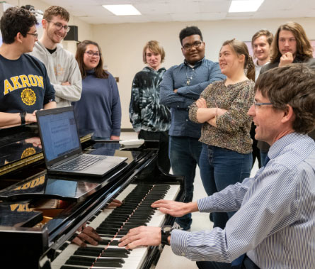 Professor James Wilding plays a Steinway for his class.