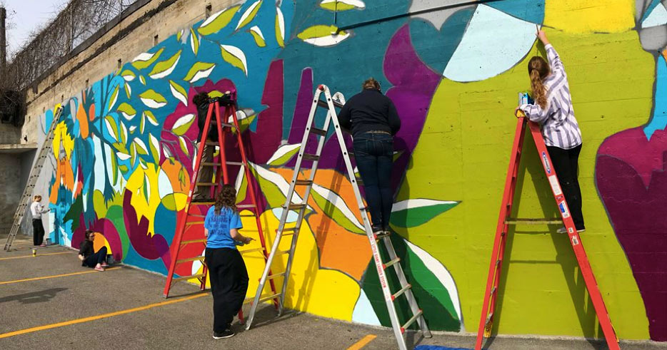 Students painting the mural