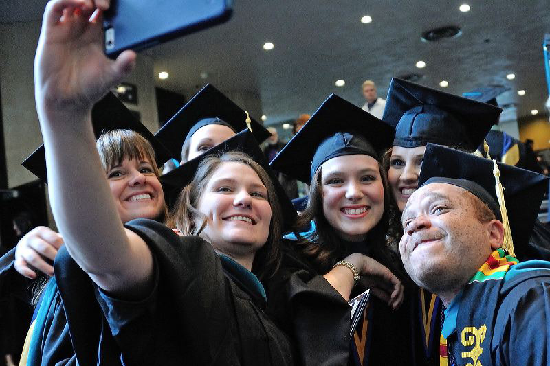 Students-in-caps-and-gowns-selfie