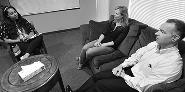 Graduate student counseling married couple in UA counseling clinic.