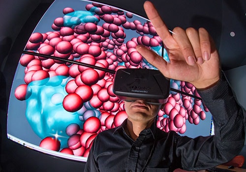 A polymer researcher in a virtual reality lab