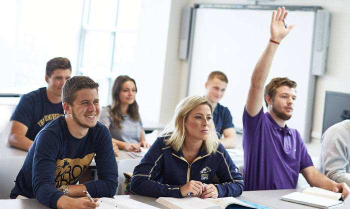 Students socializing in a exloratory community room at The University of Akron