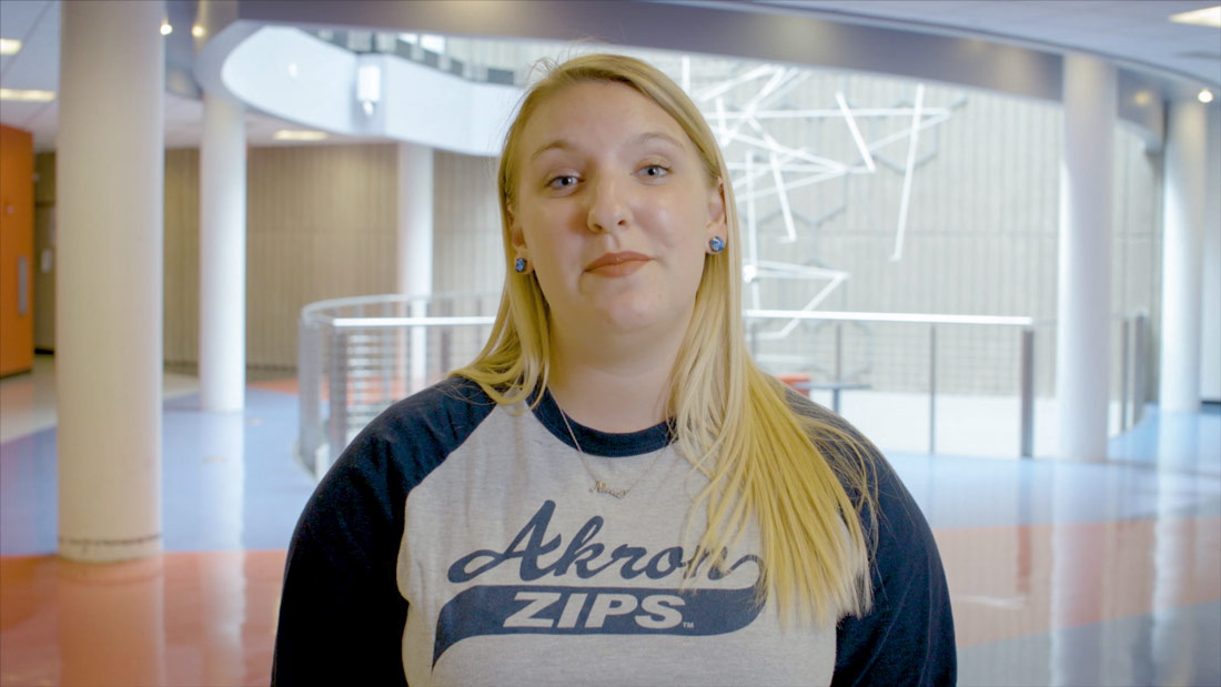 Nina Barnes standing in the dance building at The University of Akron