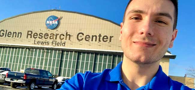 An Akron engineering student outside of NASA Cleveland, where he is interning