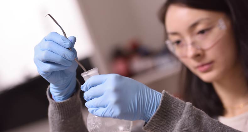 Women conducting research in labs at The University of Akron