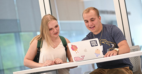 Two students working on a project who applied to The University of Akron