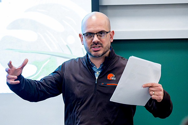Cleveland Browns staff teaching class to students at UA.