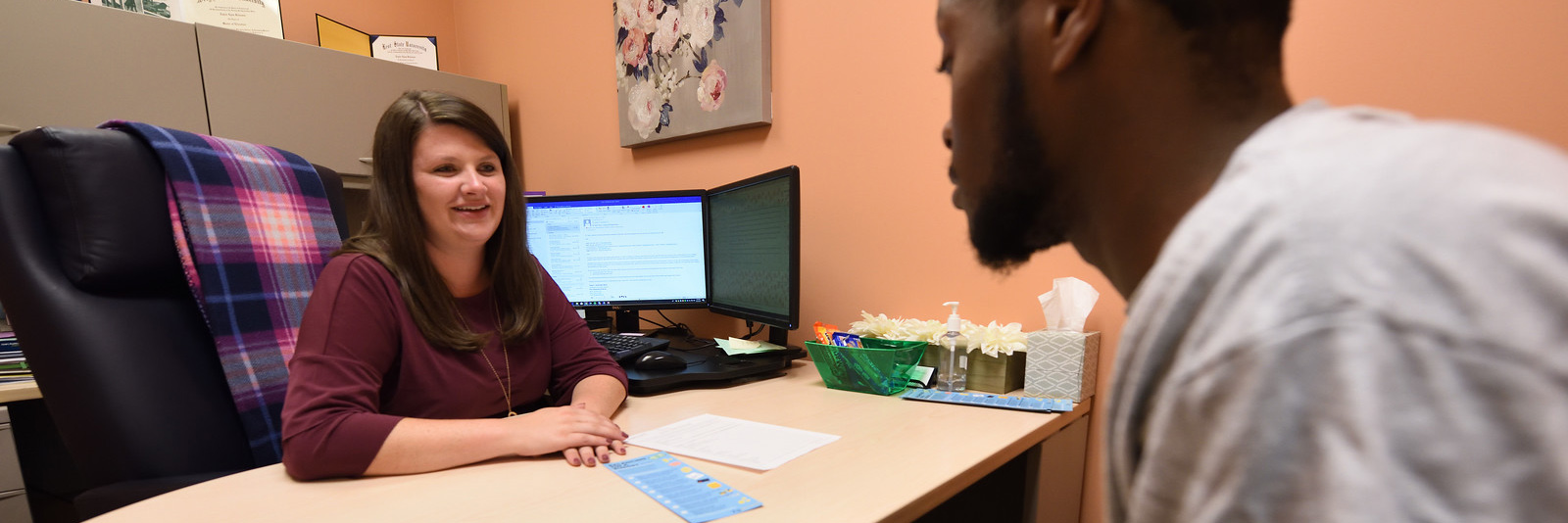 A student being assisted by an advisor