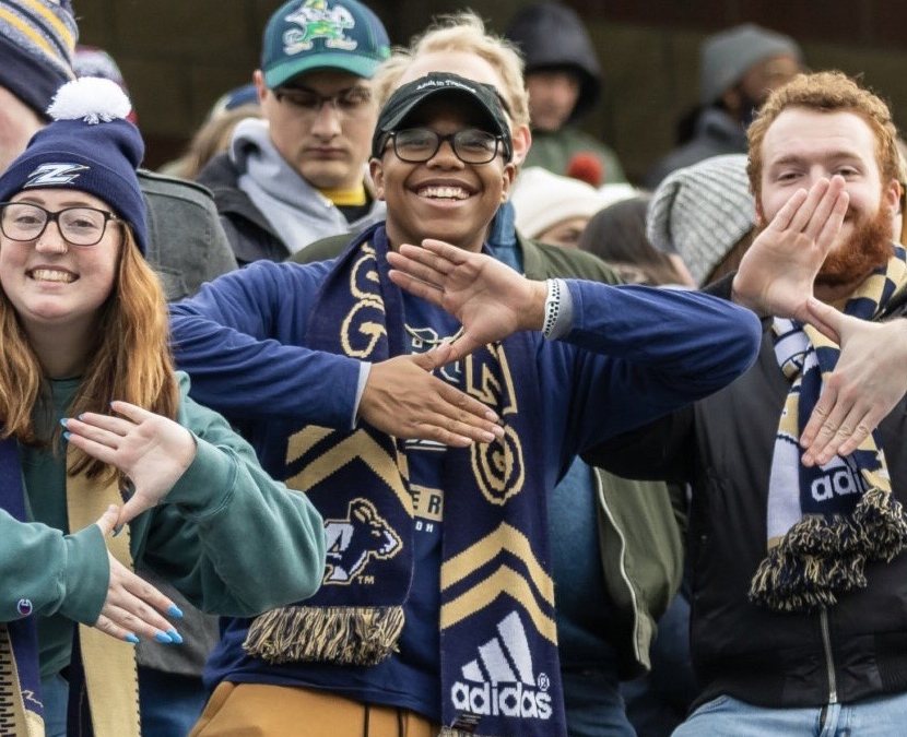 Students enjoy a Zips football game.