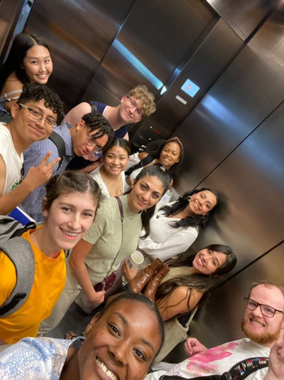 Marketing sophomore Cole Hakenson riding in an elevator with other friends from the National Millennial and GenZ community.