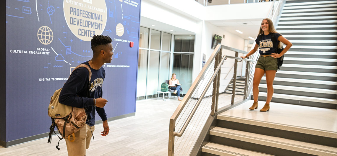 Two students talk inside the business school's new Professional Development Center