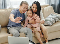 Professional working with family through online meeting