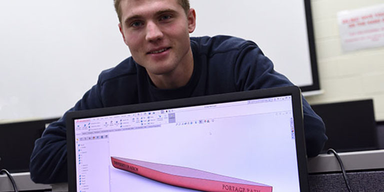 Mechanical engineering student racing in car for The University of Akron