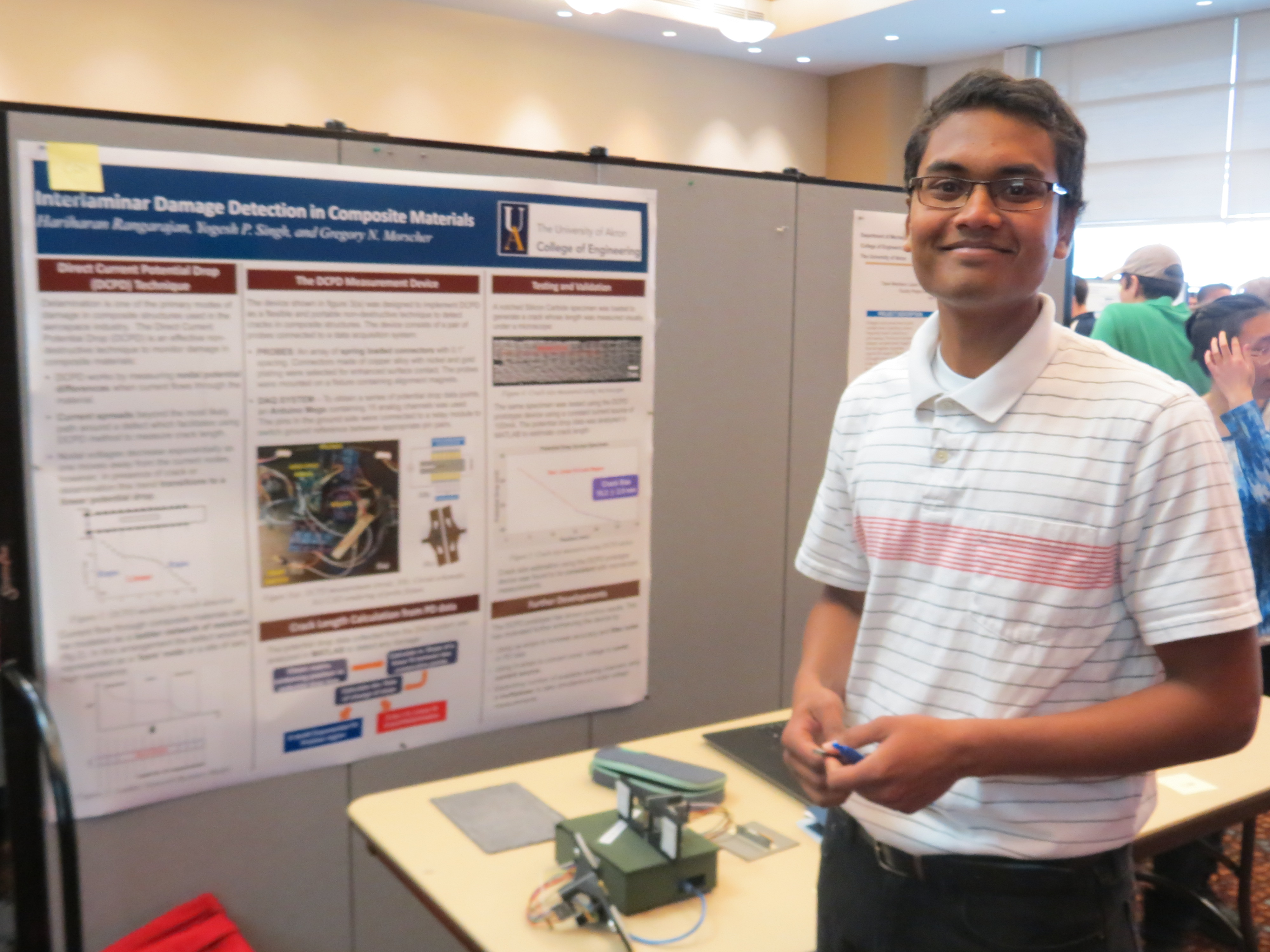 Engr_SeniorDesignDay_Project_C04_1st_Prize_Standing_near_Poster_IMG_7511