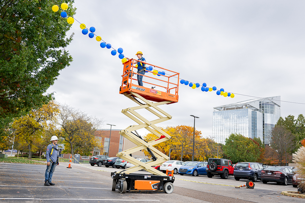 A student retrieves a balloon during Reach for the Sky.