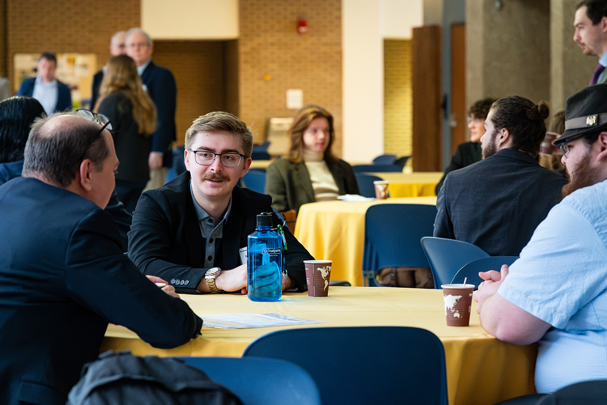 UA students networking with John Sankovic, UA alumnus and current President of the Ohio Aerospace Institute.