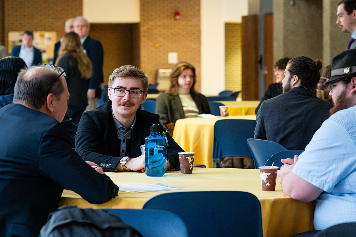 UA students networking with John Sankovic, UA alumnus and current President of the Ohio Aerospace Institute.