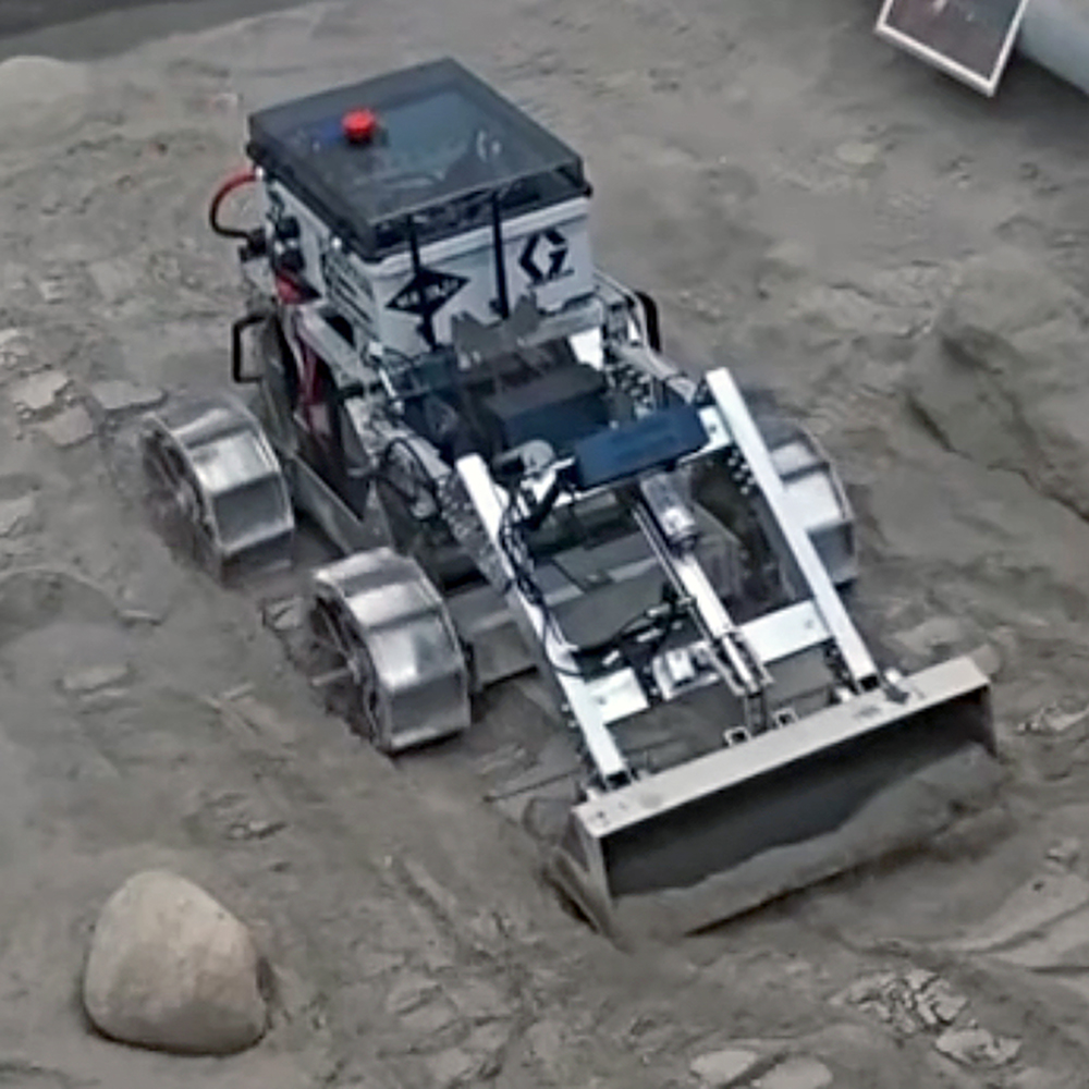 The Zips robot digs through simulated lunar soil during the Lunabotics competition.