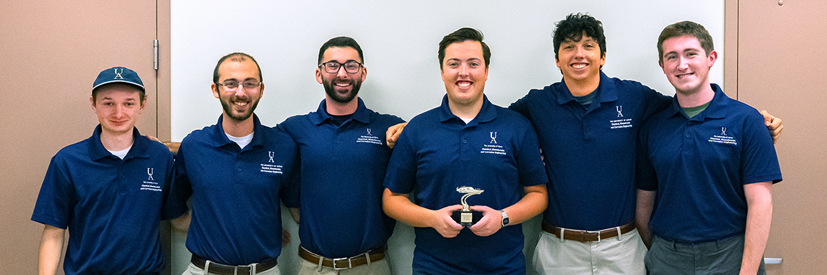 UA’s Chem-E Car team holds its trophy after placing in the global top 10 at the 2025 AIChE competition.