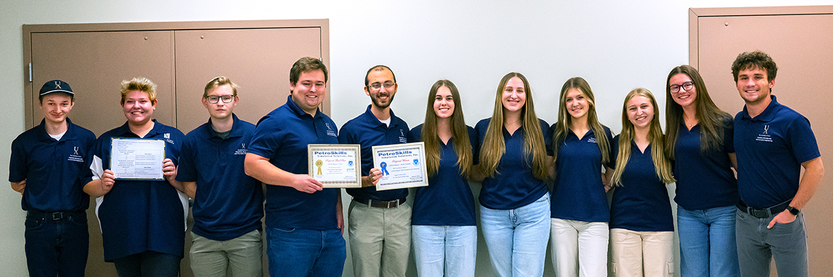 UA’s ChemE-Sports teams display their award certificates after earning the Construction Cup in the USA region.