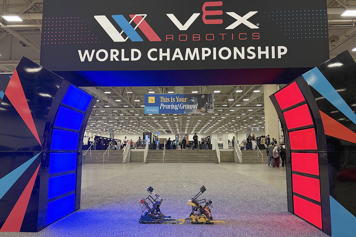 Blu and Roo, Phalanx Robotics’ competition robots, under the championship arch at the VEX Robotics World Championship.