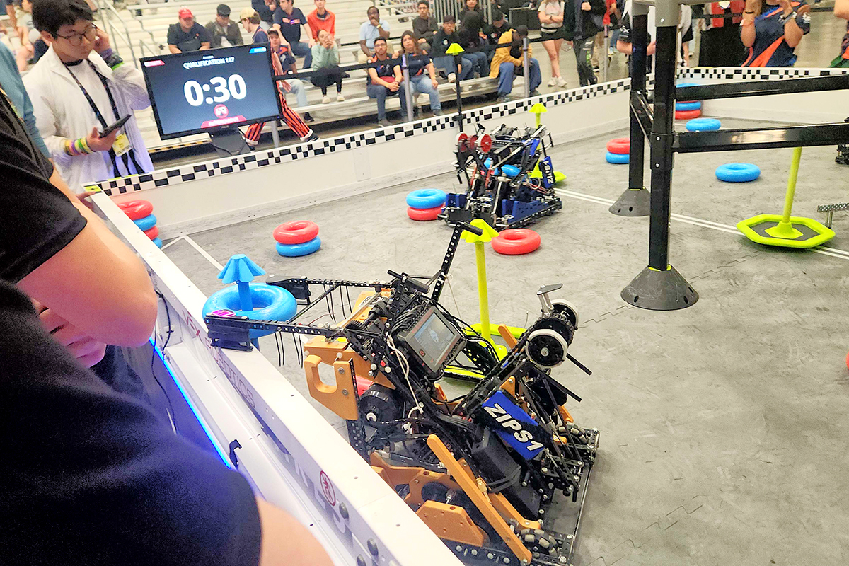Phalanx Robotics' autonomous robots line up at the start of a match, aiming to score early points and gain an advantage.