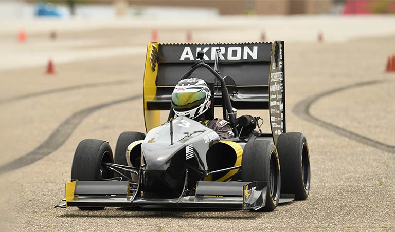A student-designed car on a track