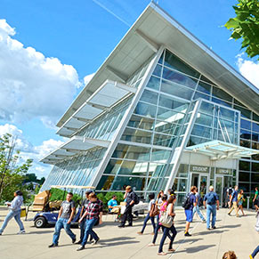 Students walk by the Student Union at the center of campus