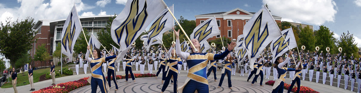 The University of Akron Marching Band performs on campus as part of a celebration.