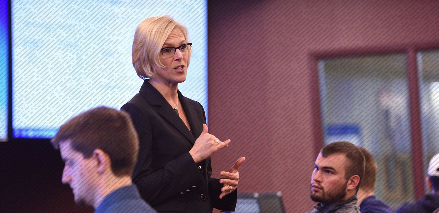 A professor in front of a graduate-level class at the University of Akron