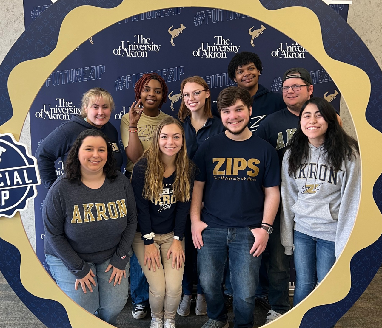 UA students with the University of Akron logo