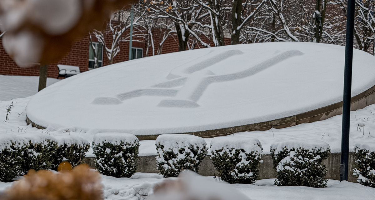 Winter photo of UA sign
