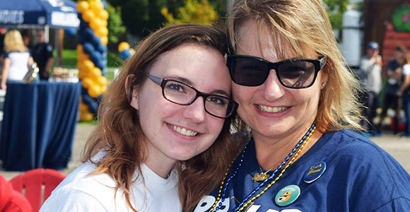 A University of Akron student with her parent during Family Weekend.