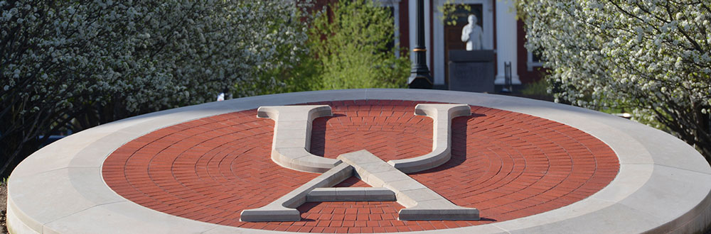 A decorative UA in brick near the center of the University of Akron campus