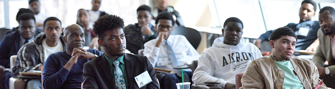 Attendees listen to a speaker during the 2019 Black Male Summit