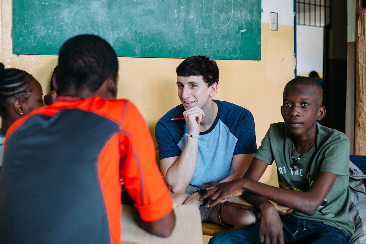University of Akron engineering major Matt Hlas talks with Haitian students during a mission trip to Ouanaminthe, Haiti