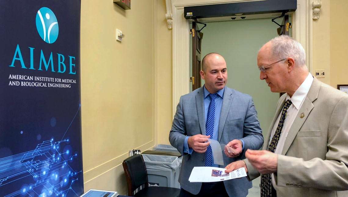 The University of Akron's Matthew Becker discusses his research team’s work on non-opioid pain management with U.S. Rep. Bill Foster