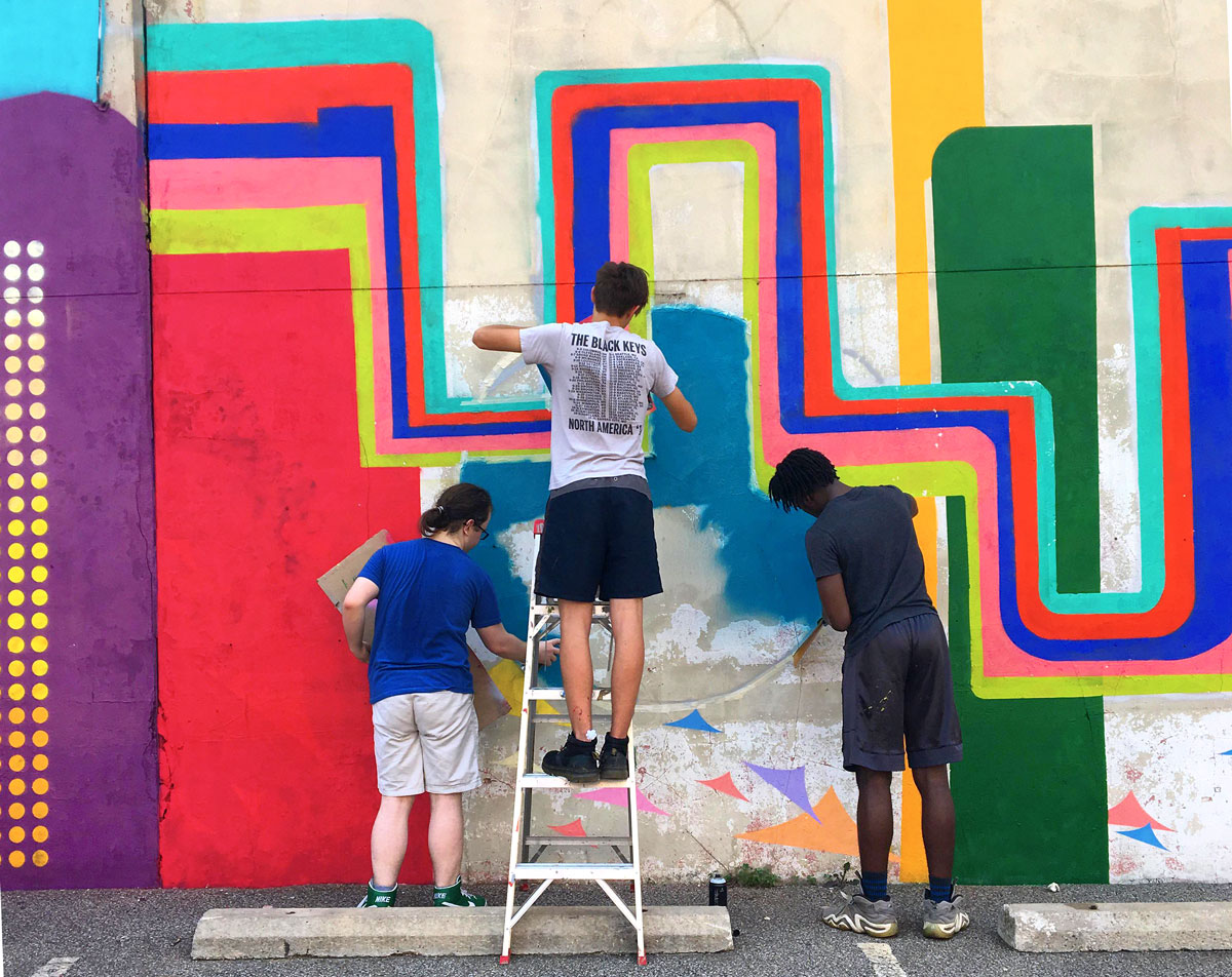 University of Akron students and others work on the latest Art Bomb Brigade installation in Akron