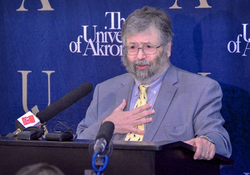 Dr. John Green, interim president of The University of Akron, discusses the many safety enhancements now in place south of Exchange Street during a news conference