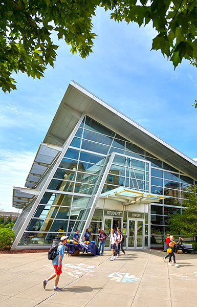 The Jean Hower Taber Student Union Students walk by the Student Union on a sunny summer day