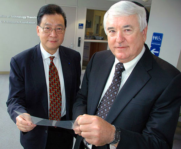 Dr. Stephen Z.D. Cheng and Dr. Frank Harris display an optical compensation film for liquid crystal displays (LCDs).