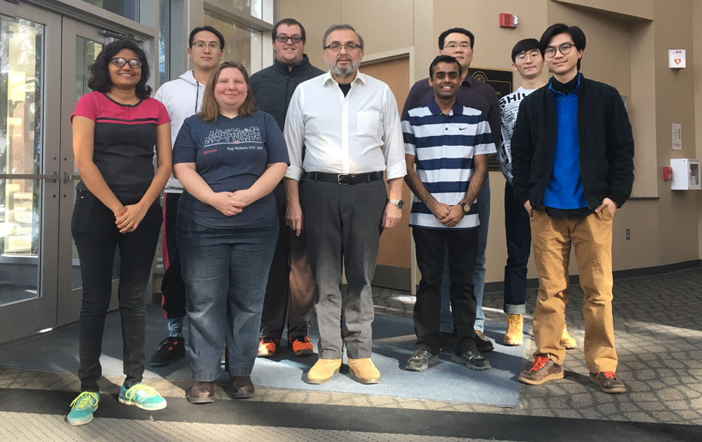 Dr. Erol Sancaktar with polymer engineering graduate students who are part of his research group.
