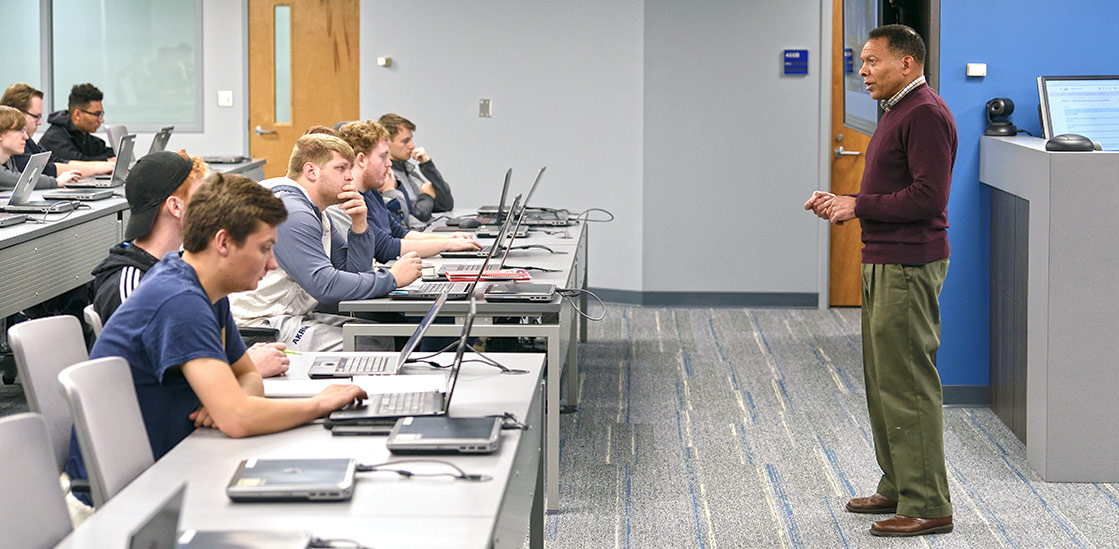 A professor in front of a cybersecurity class at The University of Akron