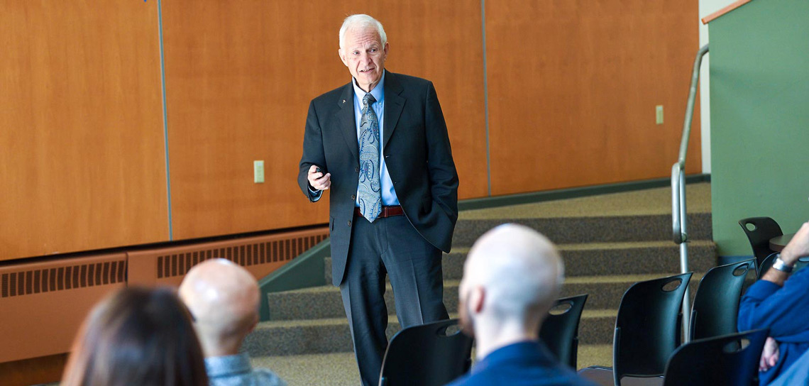 Dr. Dale Mugler, inaugural dean of the Honors College, delivers a lecture in front of students
