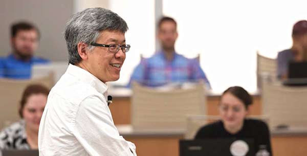 Law professor Brant Lee gestures while teaching a class