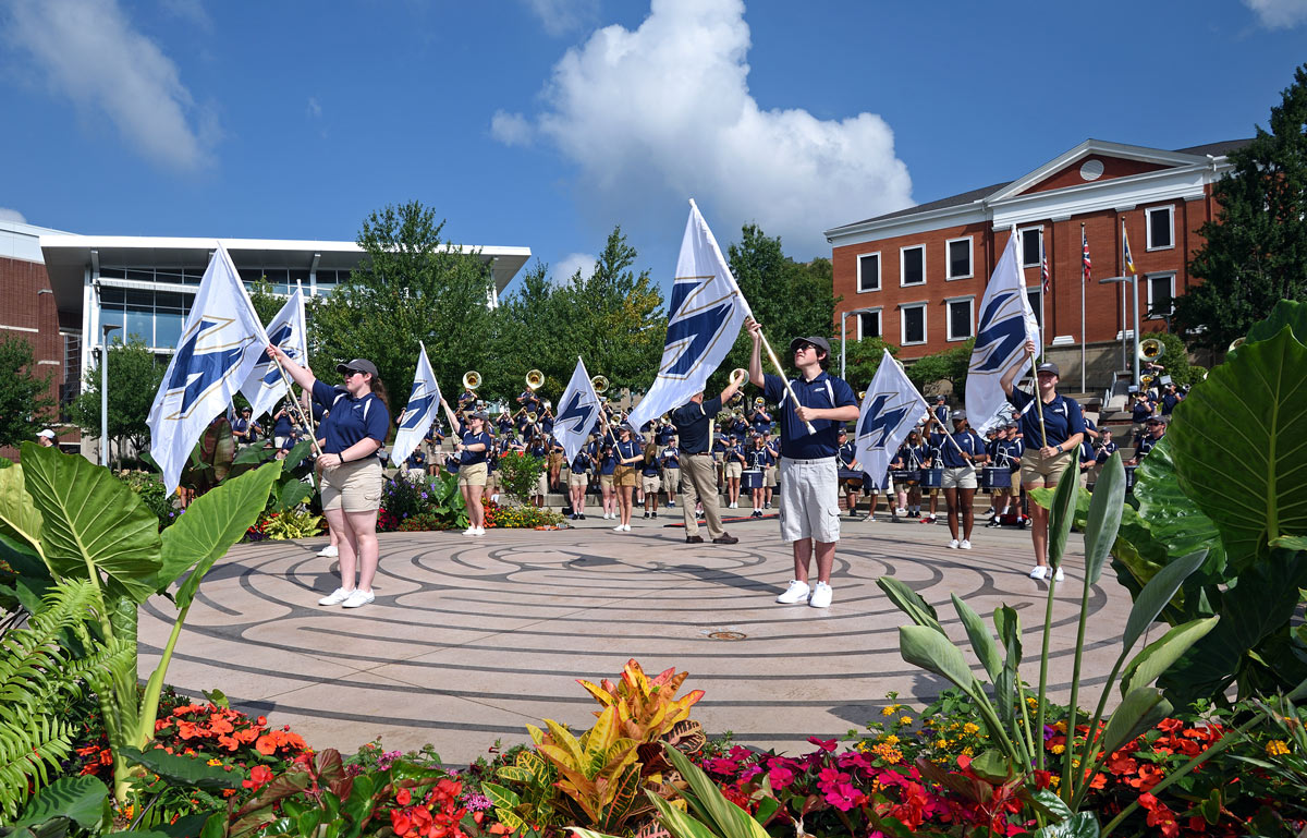 Members of Ohio's Pride perform in the ampitheater in Coleman Common at the start of Convocation.