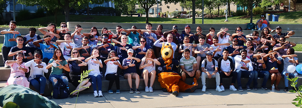 International students gather for an event at the university of akron