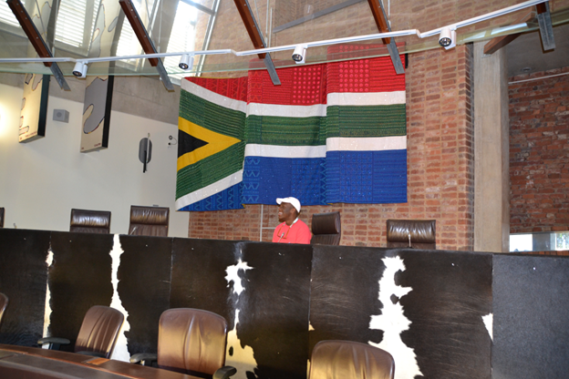 Student Sitting on Bench of South African Constitutional Court, Johannesburg, Photo by Prof. Mark Schultz