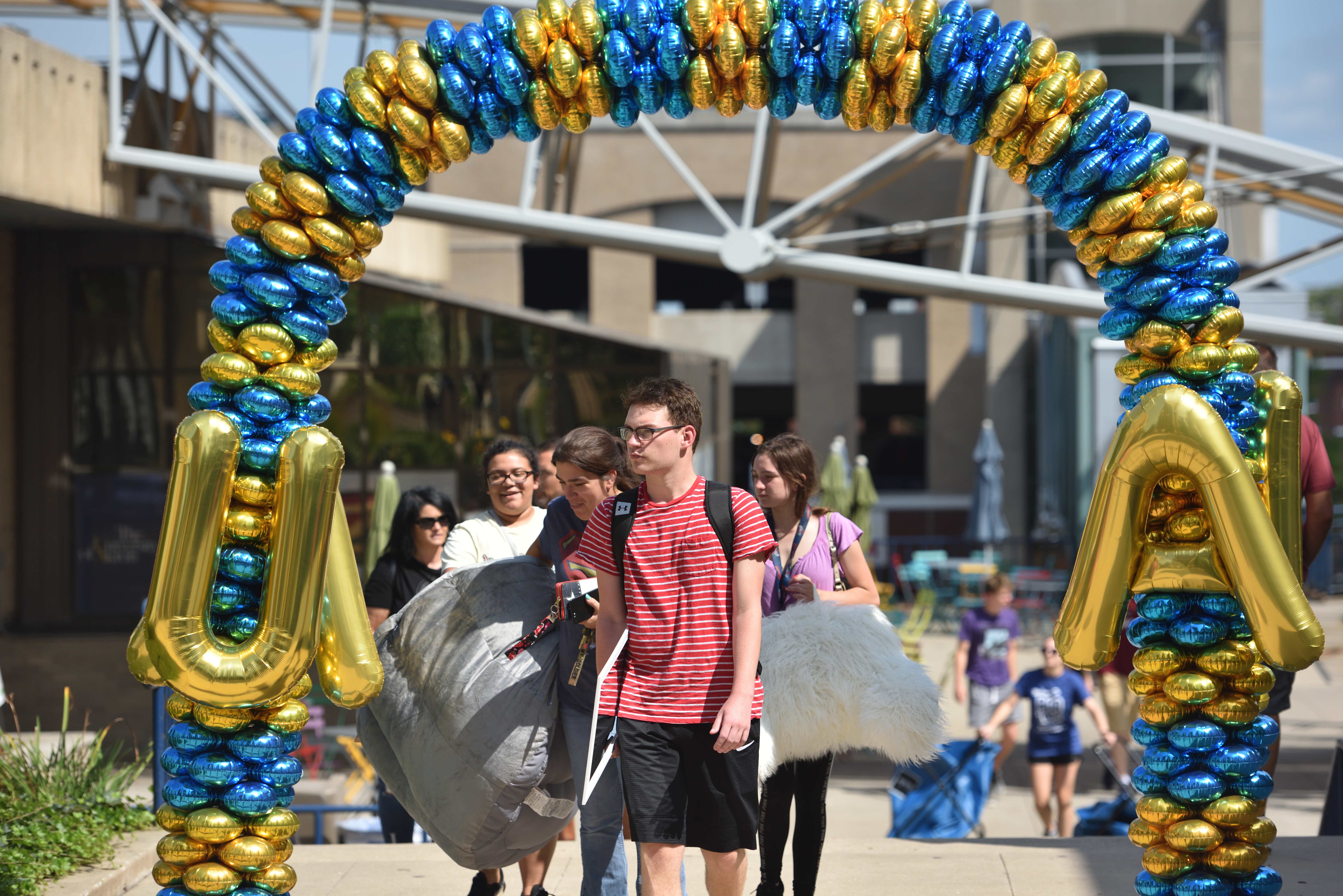 Two UA students smiling wearing Akron Pride T-shirts